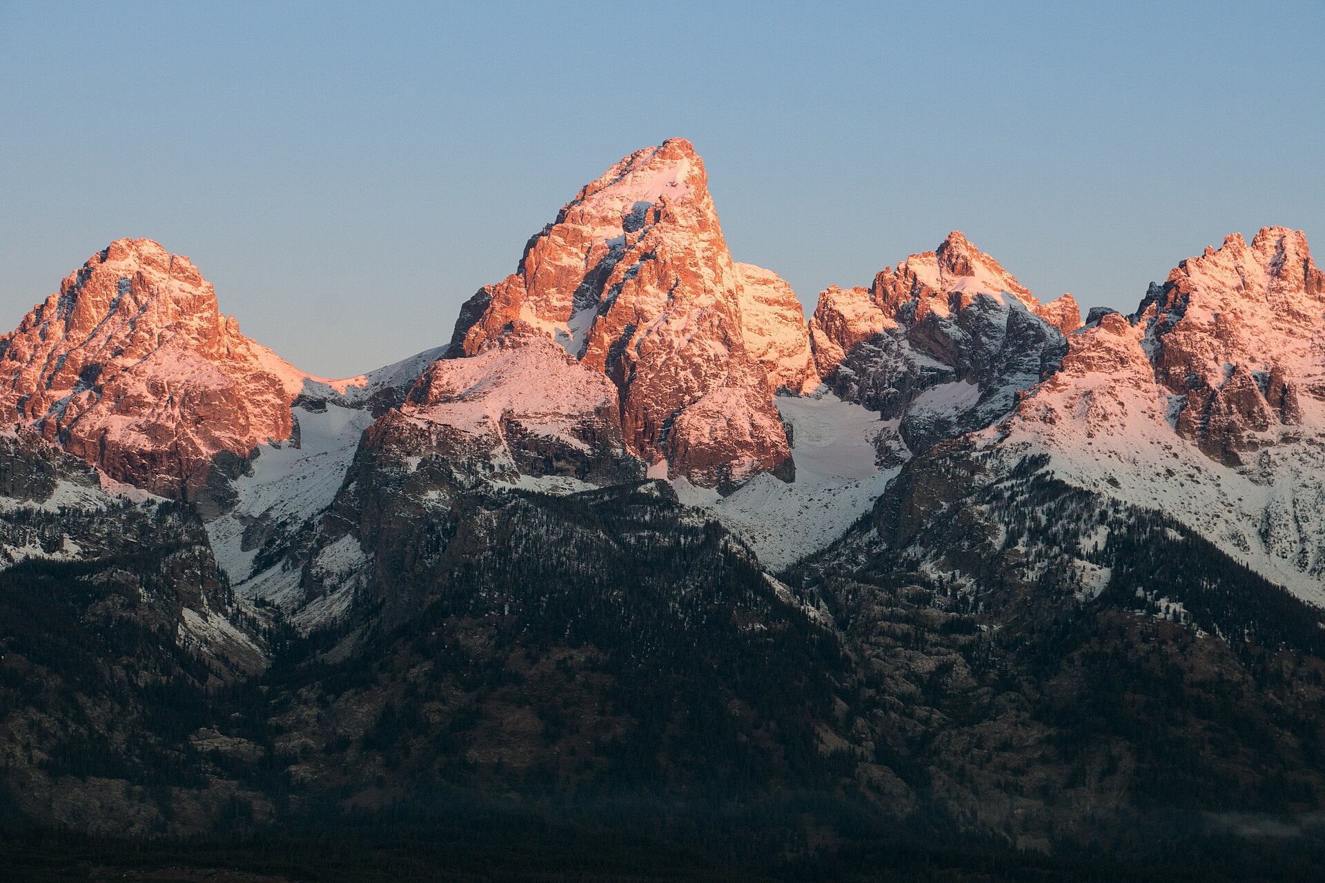 Sunrise touching the snowy Teton mountain range